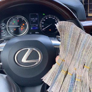 I got cash on the dash, guns in the back
