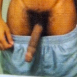 grabbing his penis