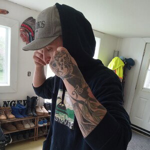 Creepin' through the shadows, thoughts heavy like a boulder,  